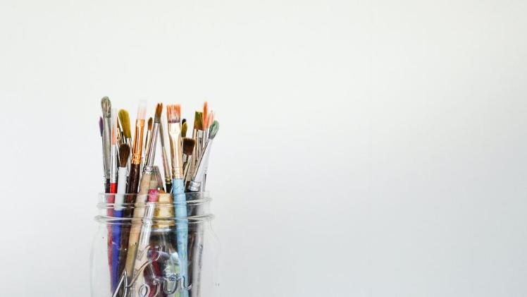 Paint brushes in mason jar